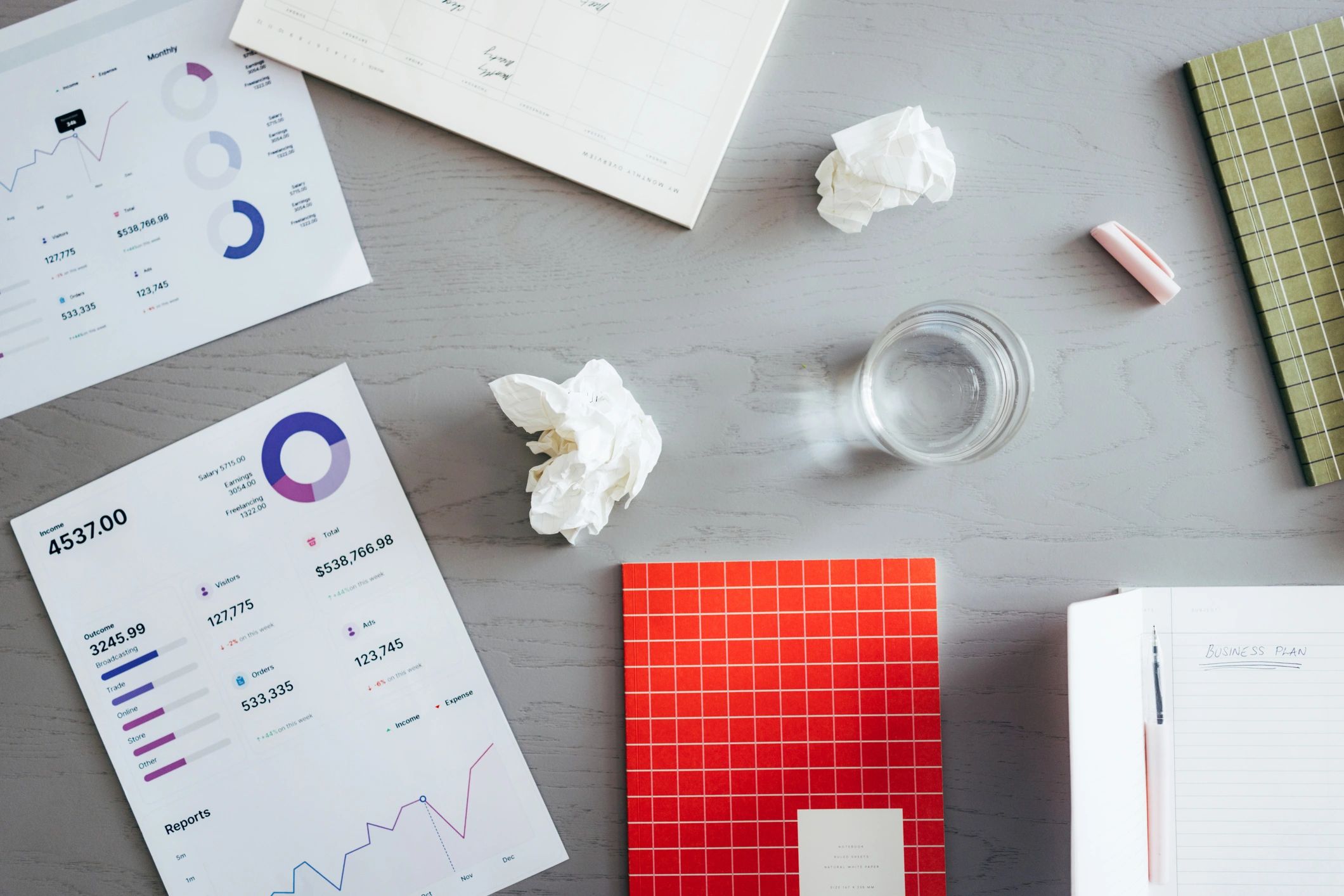Professional office workspace with reports and planning documents